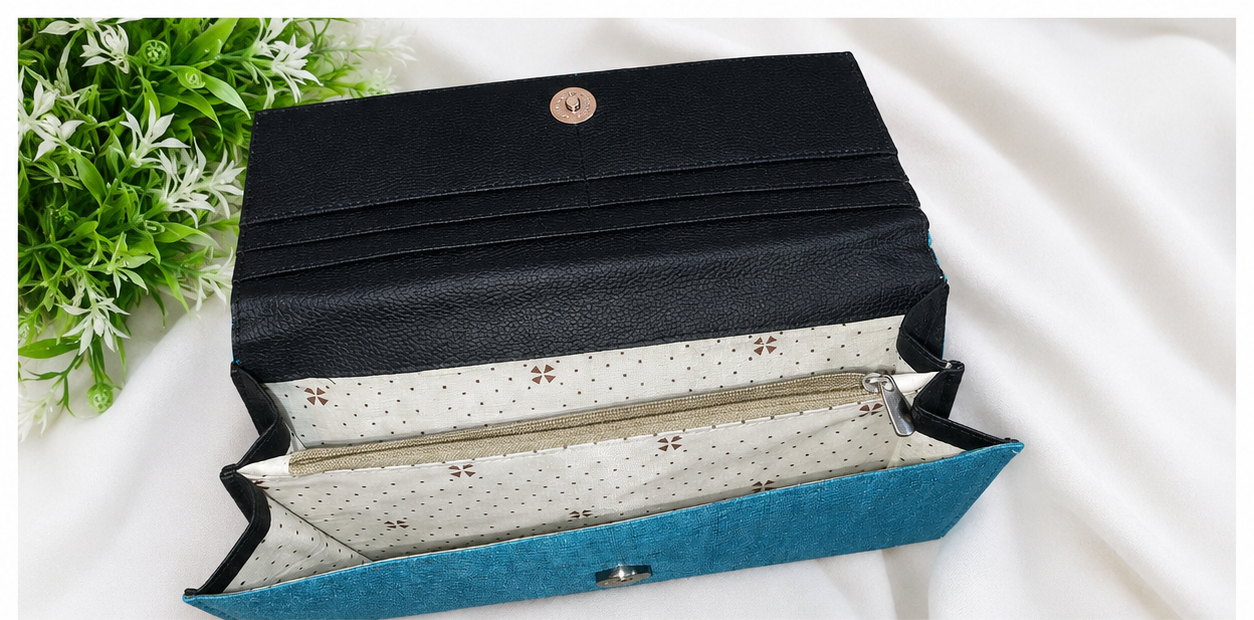 A three-panel collage showing a long wallet or clutch in different views. The top panel shows the wallet open, revealing a black exterior flap, cream patterned interior lining, and a turquoise blue base.