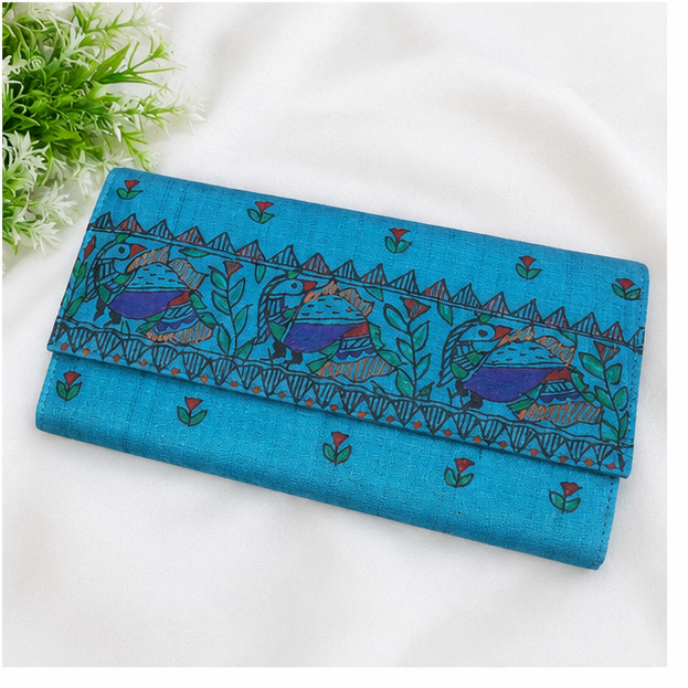 A three-panel collage showing a long wallet or clutch in different views. The top panel shows the wallet open, revealing a black exterior flap, cream patterned interior lining, and a turquoise blue base.