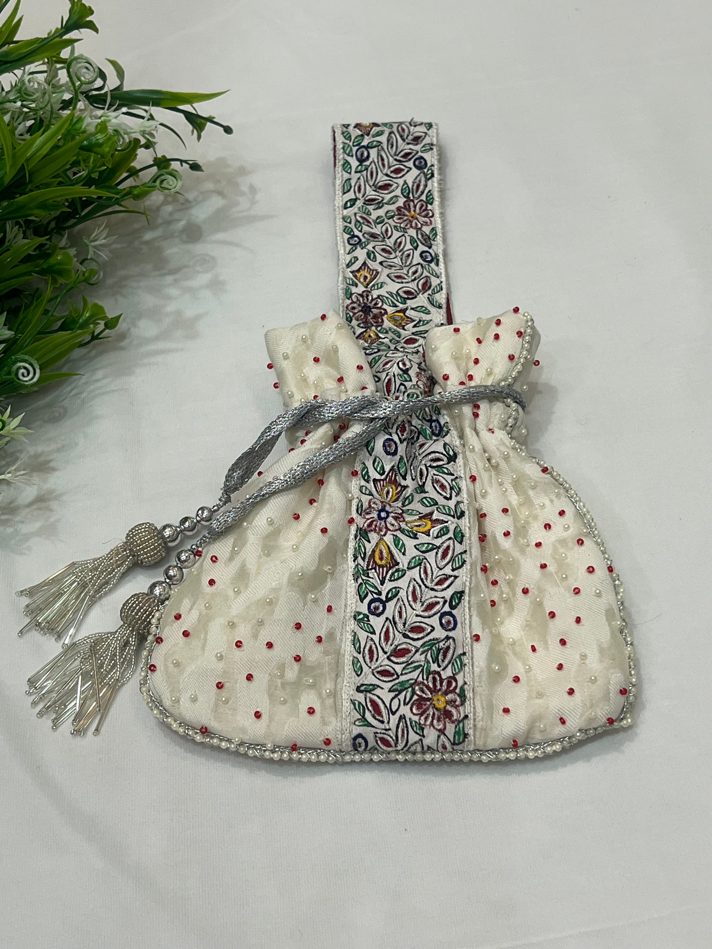 Hand-Painted White Potli with Pearl and Red Bead Accents
