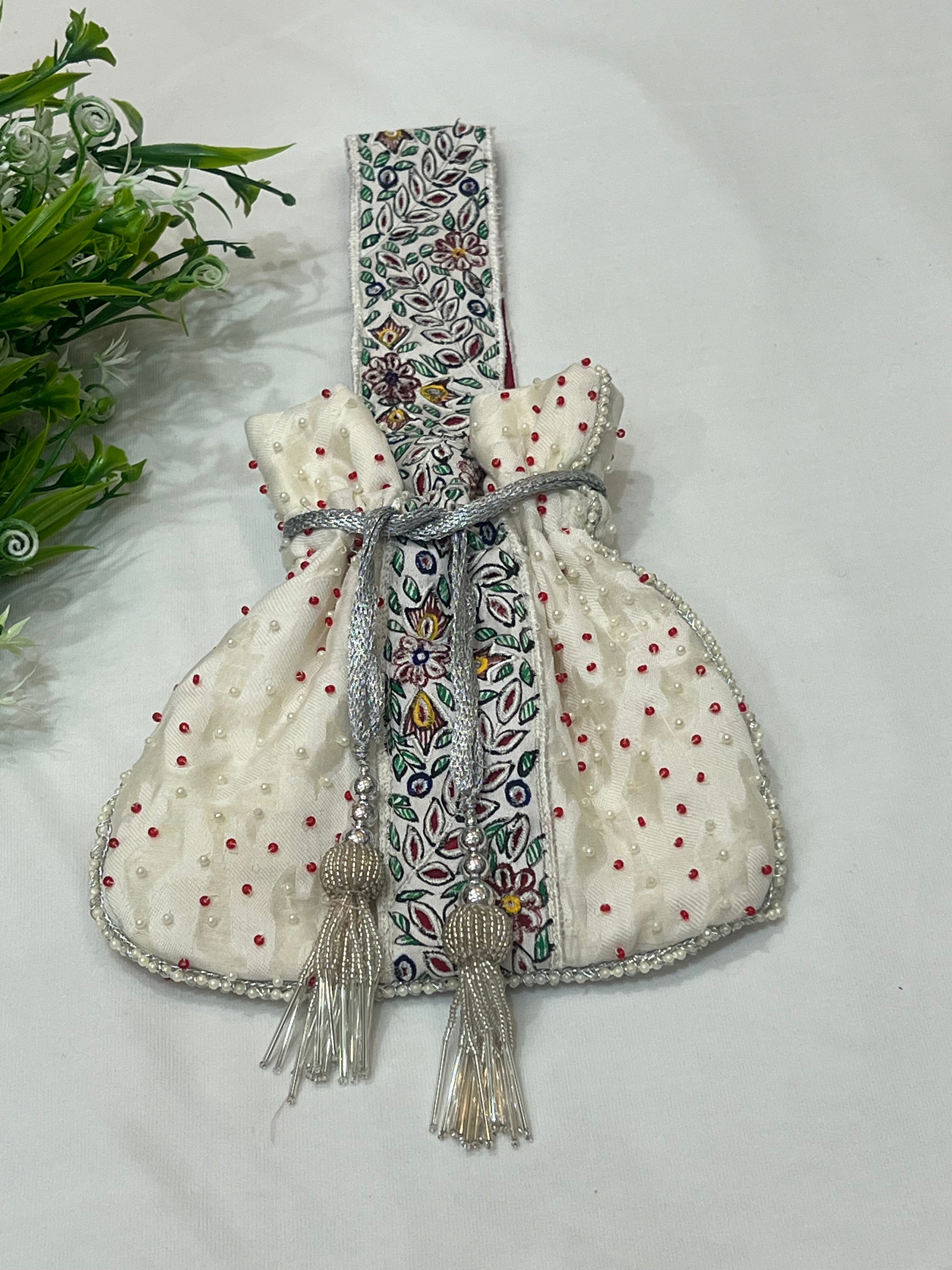 Hand-Painted White Potli with Pearl and Red Bead Accents