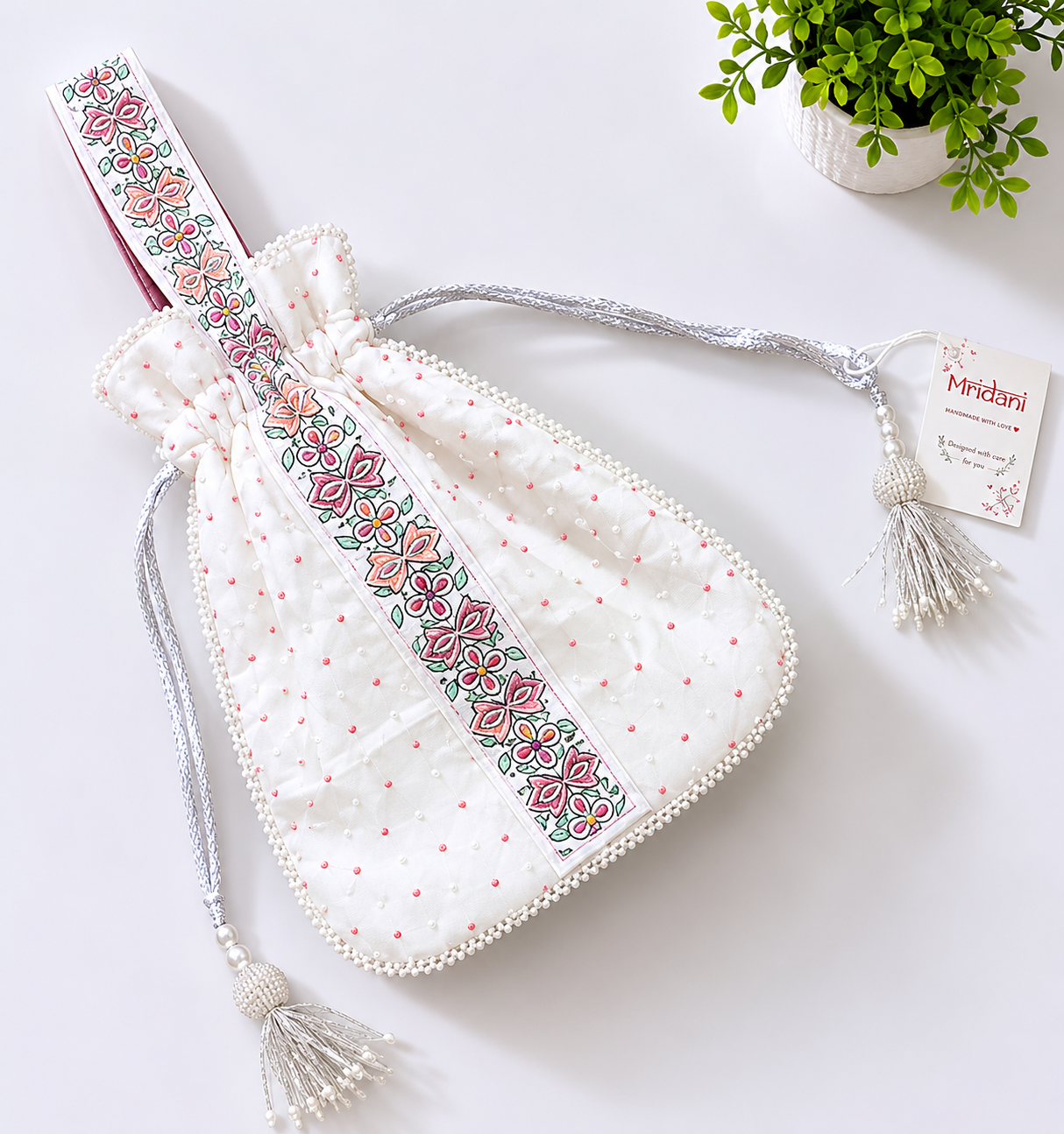Handcrafted Floral Cutwork Potli on Ivory Cream Base