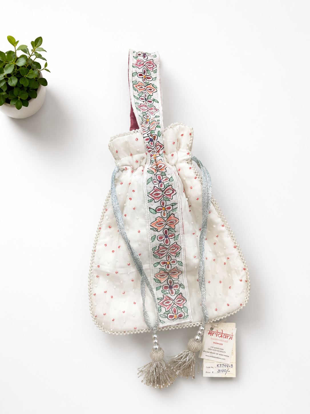Handcrafted Floral Cutwork Potli on Ivory Cream Base